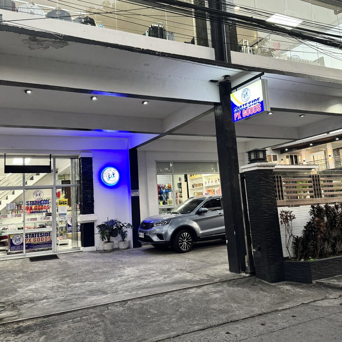 The Stateside PX Goods shopfront in Tanza, Cavite, lit up in the evening
